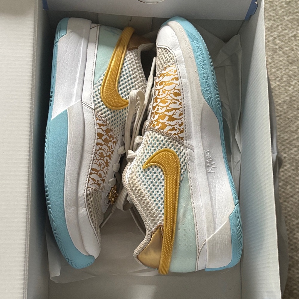 Nike White and Gold Sneakers with Light Blue Soles